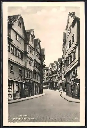 AK Kassel, Strassenpartie am Graben mit alten Häusern & Geschäften