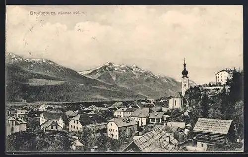 AK Greifenburg, Totalansicht mit Bergen im Hintergrund