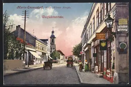 AK Maria-Enzersdorf /N.-Oe., Geschäfte in der Wiener Strasse, Wallfahrtskirche