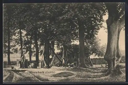 AK Nieuwkerk /Goirle, Mann und Hund an einem Brunnen