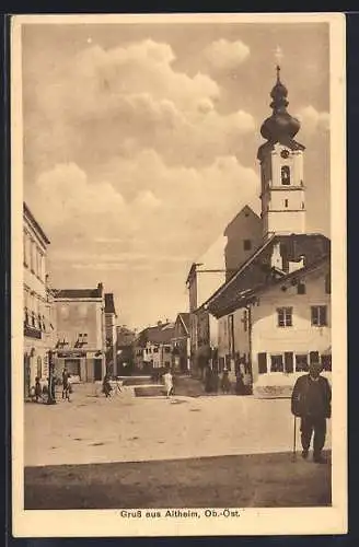 AK Altheim /Ob.-Öst., Strassenpartie mit Geschäft und Kirche