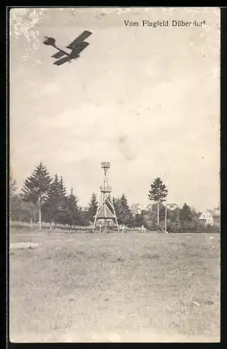 AK Dübendorf, Flugfeld mit fliegendem Flugzeug und Tower