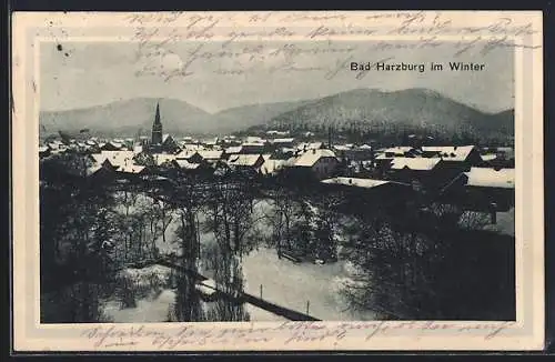 AK Bad Harzburg, Winteransicht mit verschneiter Stadt und Kirche