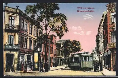 AK Wilhelmshaven, Bismarckstrasse bei abendlicher Dämmerung, Strassenbahn