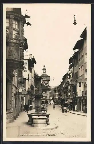 AK Schaffhausen, Strassenpartie in der Vorstadt mit Brunnen