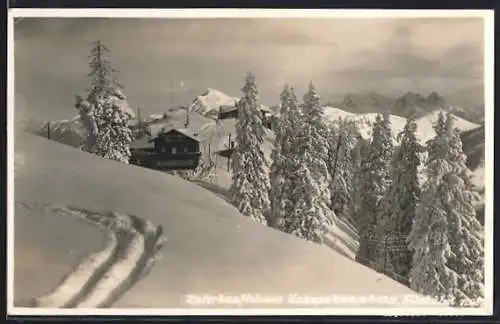 AK Kitzbühel, Unterkunftshaus Hahnenkamm mit Umgebung im Winter