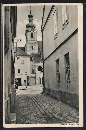 AK Neunkirchen, Gassenpartie mit Kirchturm