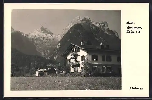 AK Lofer, Haus Hinterseer mit Berglandschaft