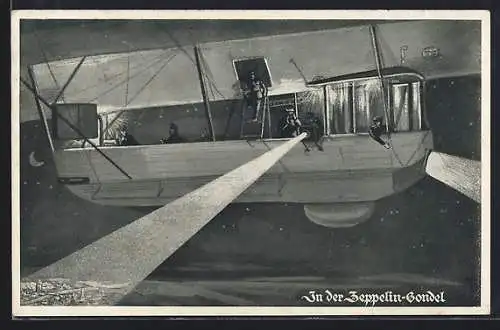 AK In der Zeppelin-Gondel, Leute schauen aus der Gondel auf den Ort bei Nacht