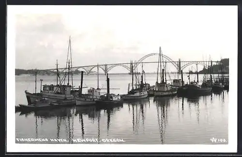 AK Newport, OR, Fishermens Haven with several fishing vessels and bridge
