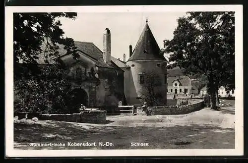 AK Kobersdorf, Strassenpartie mit altem Gebäude