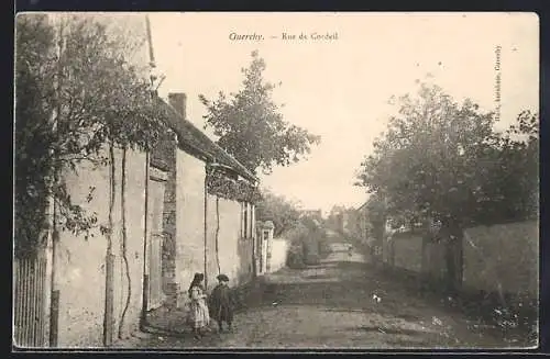 AK Guerchy, Rue de Cordeil avec enfants jouant sur le trottoir