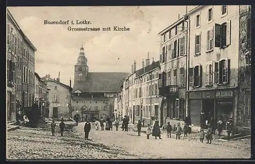 AK Busendorf i. Lothr., Grossestrasse mit Kirche und Geschäft Joh. Beuriger