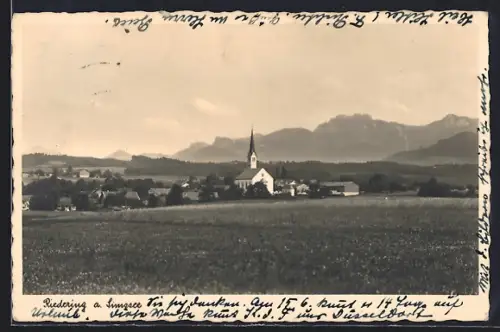 AK Riedering a. Simssee, Ortsansicht mit Berglandschaft