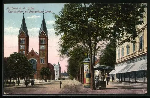 AK Marburg a. d. Drau, Tegetthoffstrasse mit Franziskaner-Kirche, Litfasssäule und Warenhaus Turad