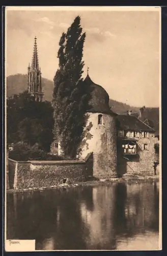 AK Thann, Vue de la tour médiévale et de l`église au bord de l`eau