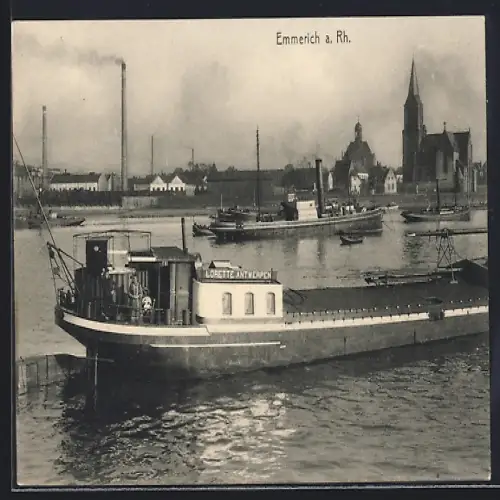 AK Emmerich a. Rh., Flusspartie mit Ortschaft und Güterschiffen