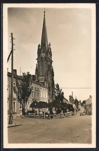 AK Delme, Vue de l`église et de la rue du Général Nassoy
