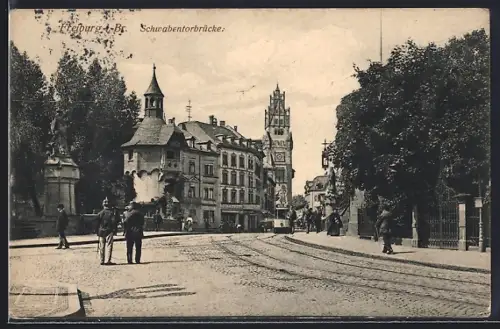 AK Freiburg i. Br., Strassenpartie an der Schwabentorbrücke, Strassenbahn