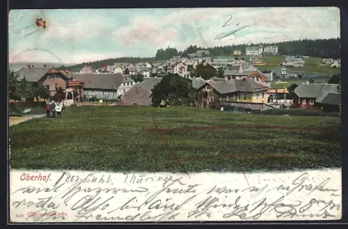 AK Oberhof, Ortsansicht mit Häusern und Wiese