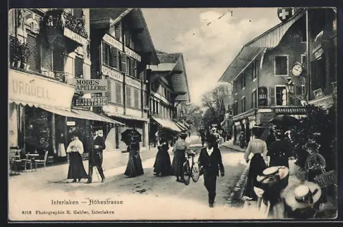 AK Interlaken, Höhestrasse mit Spaziergängern und Geschäften