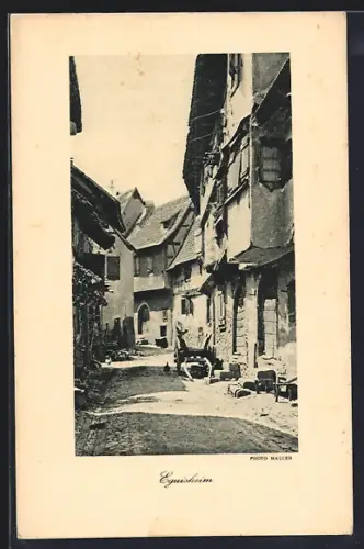 AK Eguisheim /Alsace et Vosges, Rue pittoresque avec maisons à colombages