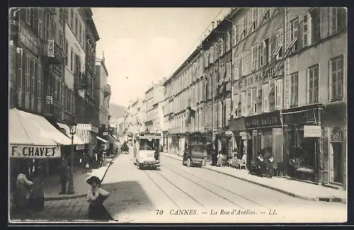 AK Cannes, La Rue d`Antibes, Strassenbahn