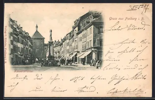 AK Freiburg i. B., Kaiserstrasse mit Uhrenturm und Brunnen