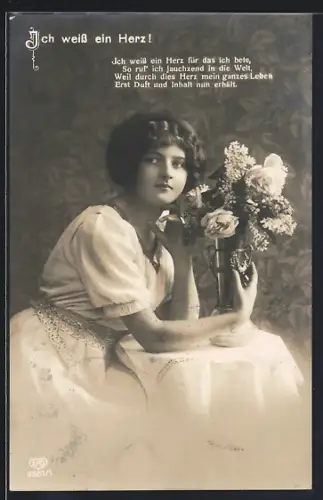 Foto-AK EAS Nr. 9561/1: Ich weiss ein Herz!..., Junge Frau mit Blumen am Tisch