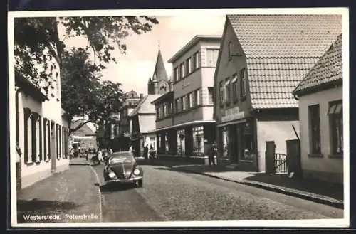 AK Westerstede, Peterstrasse mit VW-Käfer und Geschäften