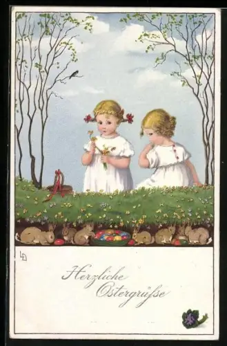 Künstler-AK Lia Döring: Herzliche Ostergrüsse, zwei kleine Mädchen sitzen im Gras, die Osterhasen haben sich versteckt