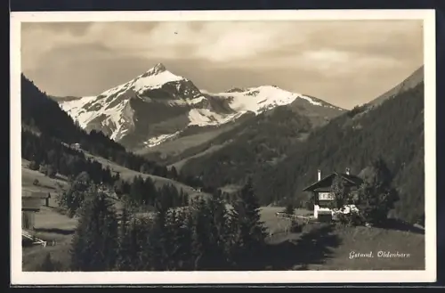 AK Gstaad, Alpenhaus mit Blick zum Oldenhorn