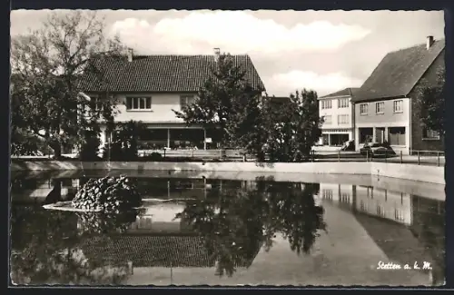 AK Stetten a. k. M., Häuser am Weiher