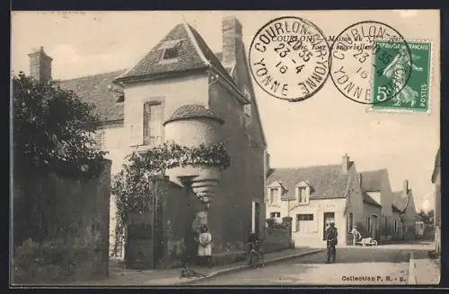 AK Courlon, Rue calme avec cycliste et bâtiments traditionnels