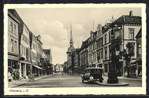 AK Oldenburg i. O., Strassenpartie mit Auto und Radfahrer
