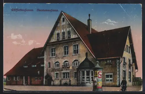 AK Wilhelmshaven, Seemannshaus mit Litfasssäule, Radfahrer