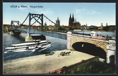 AK Köln a. Rhein, Hängebrücke mit Dampfer, Im Hintergrund Dom