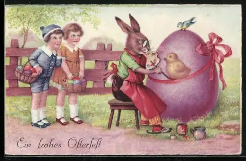 AK Osterhase bemalt ein Osterei