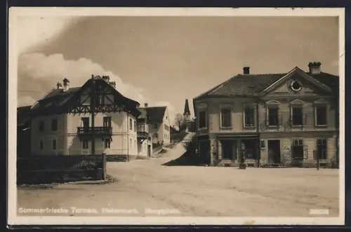 AK Turnau /Stmk., Hauptplatz, Panorama mit Geschäftshaus, Strasse und Kirchturm