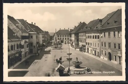 AK St. Veit a. d. Glan, Hauptplat mit Geschäften, Brunnen und Denkmal