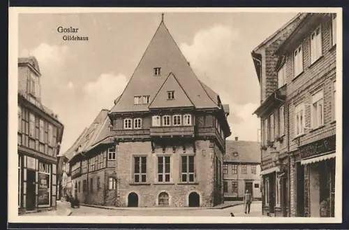 AK Goslar, Strassenpartie mit Geschäften und Gildehaus