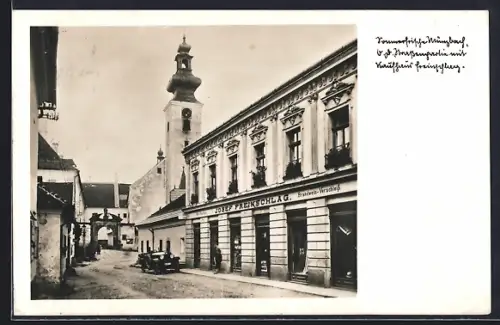 AK Münzbach /O. D., Strassenpartie mit Kaufhaus Josef Freinschlag und Blick zur Kirche