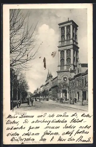 AK Dessau, Strassenansicht mit Kirche und Turm