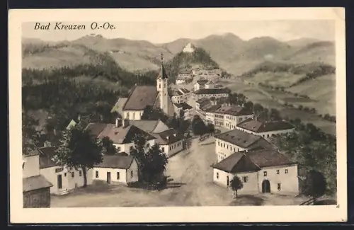 Künstler-AK Bad Kreuzen /O.-Oe., Strassenpartie mit Kirche