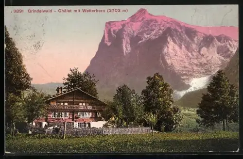 AK Grindelwald, Chalet mit Blick auf das Wetterhorn bei Dämmerung