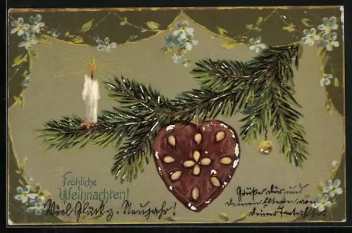 Präge-AK Lebkuchen-Herz hängt an einem Zweig des Weihnachtsbaums, Fröhliche Weihnachten