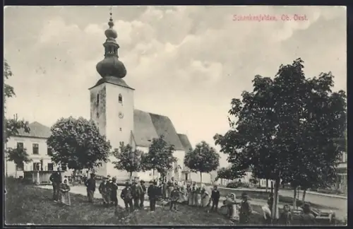 AK Schenkenfelden /Ob.-Oest., Strassenpartie mit Kirche