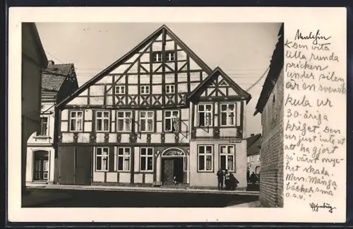 AK Malchin, Strasse, Fachwerkhaus