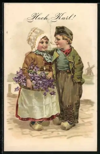Präge-AK Namenstag Karl, Zwei holländische Kinder mit Blumenkorb