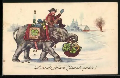 AK Glücks-Elefant, Knabe mit Geschenken und Glücksbringern auf dem Rücken eines Elefanten